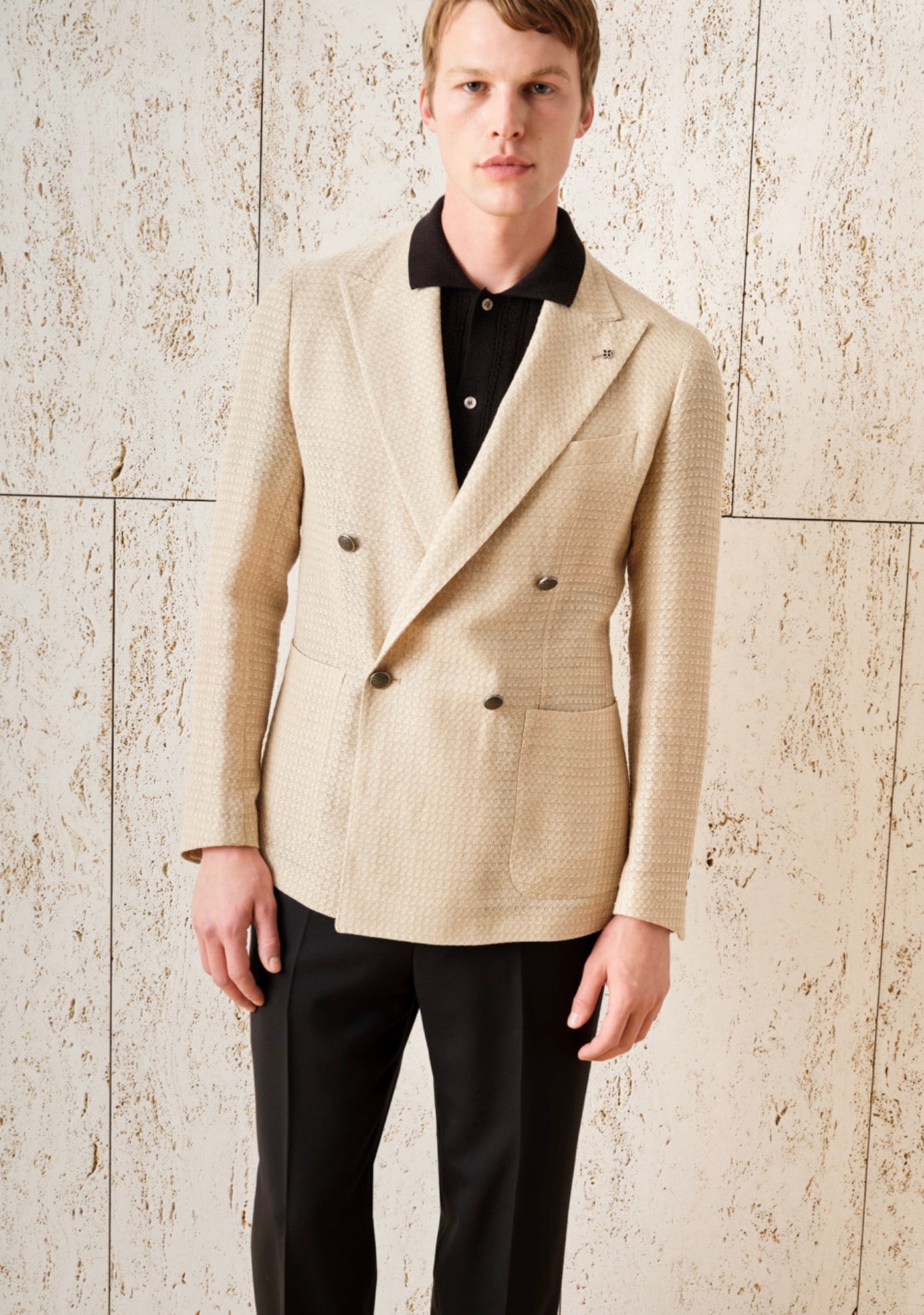 Tagliatore model with beige knit jacket