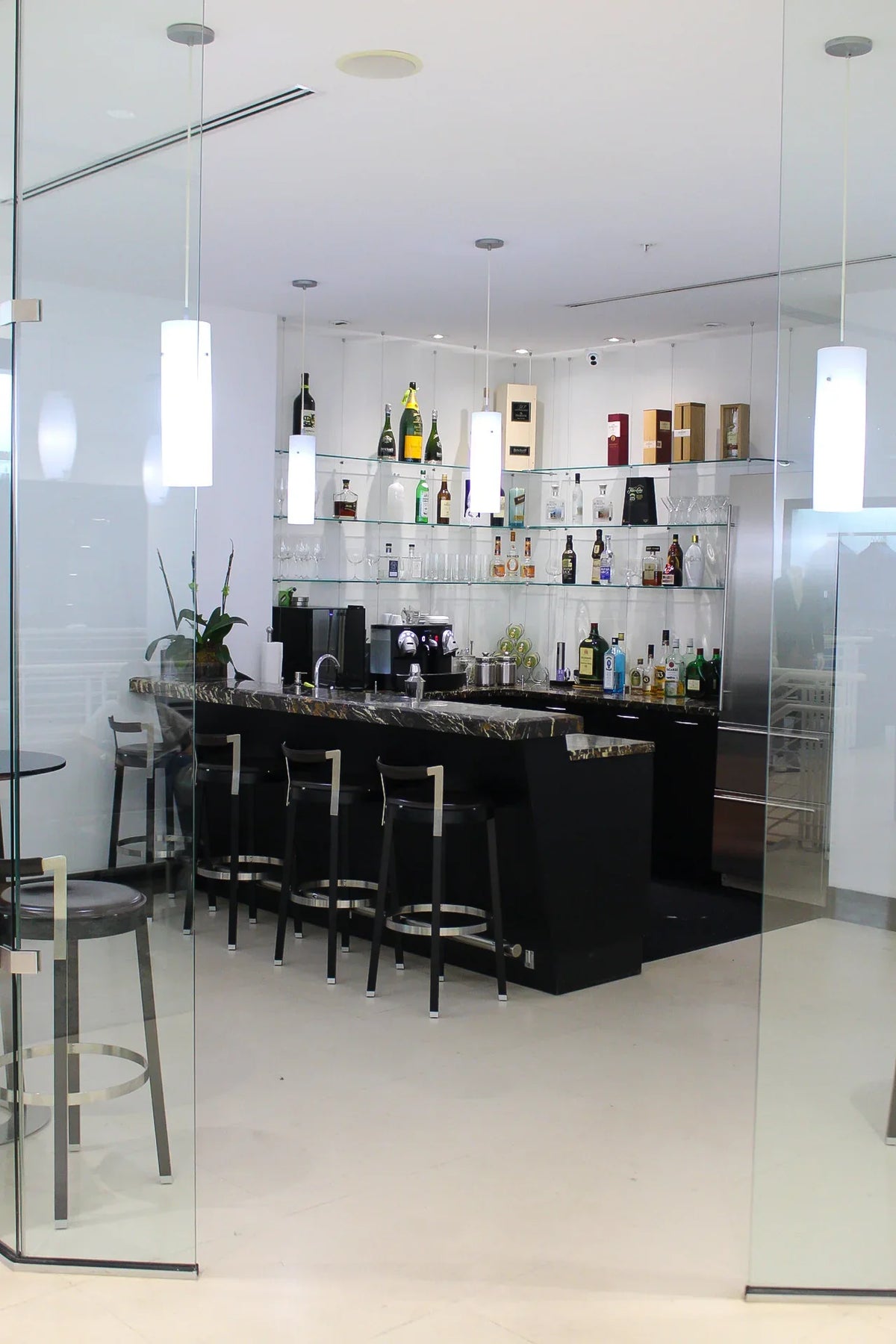 The in-store bar at Damiani, where clients can relax and unwind while they shop for their custom clothing.