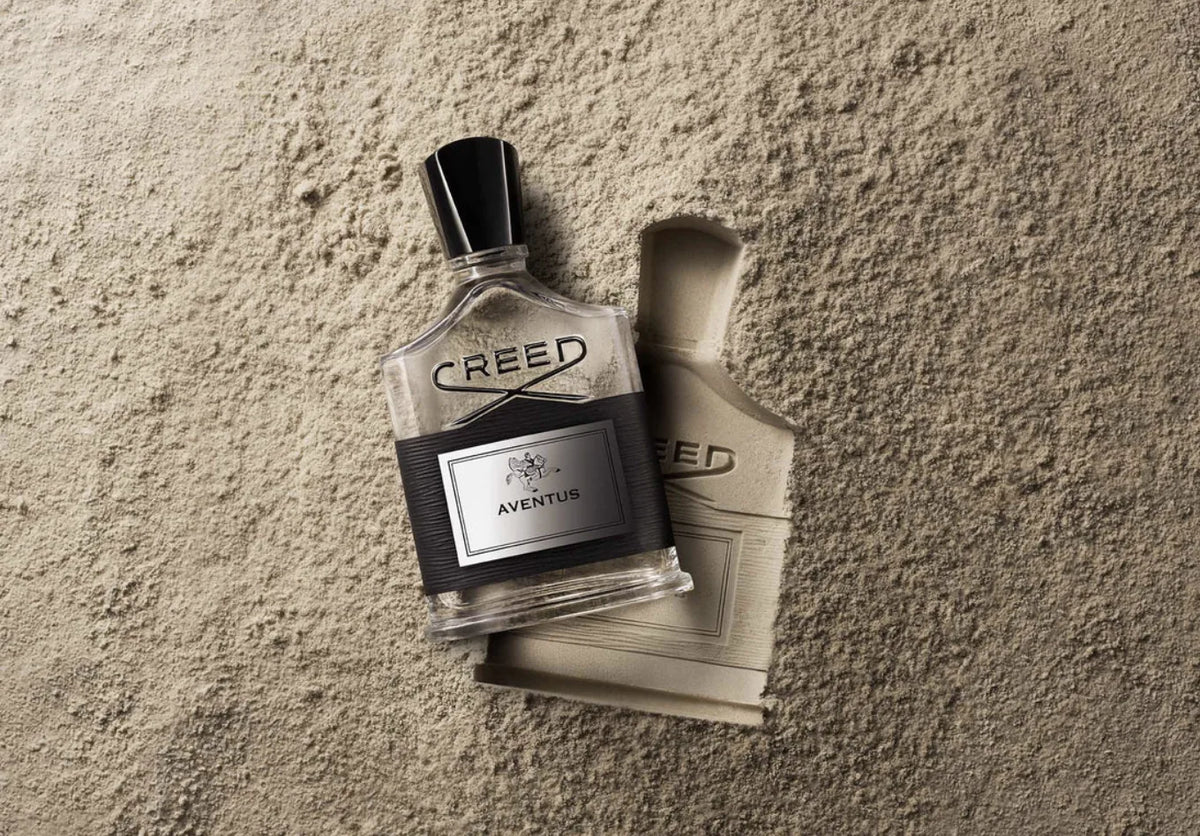 Creed bottle in the sand