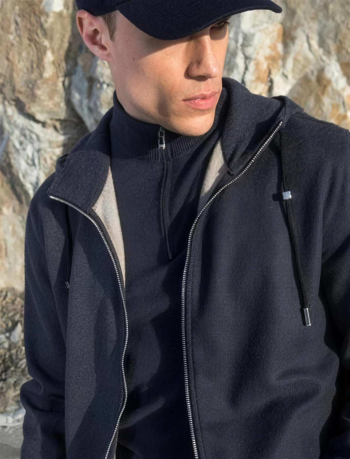 Man in a charcoal Marco Pescarolo zip jacket and cap