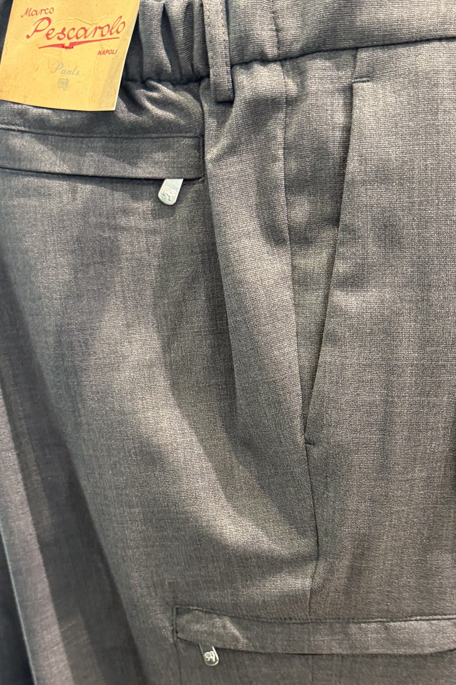 Close-up of Marco Pescarolo Metis trousers in grey with the zippered cargo pocket