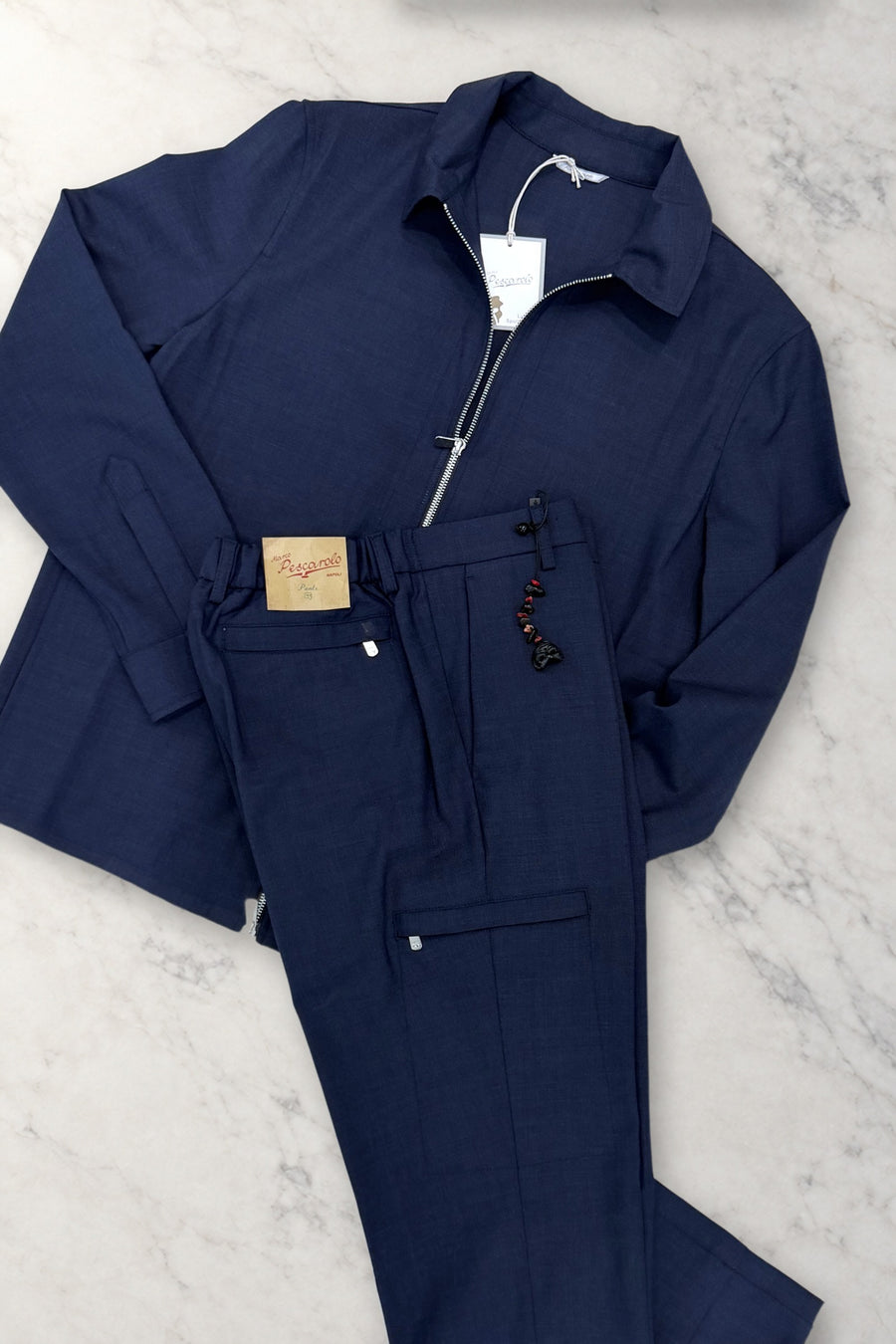 Navy Marco Pescarolo tropical wool Urus jacket and trousers set on white marble