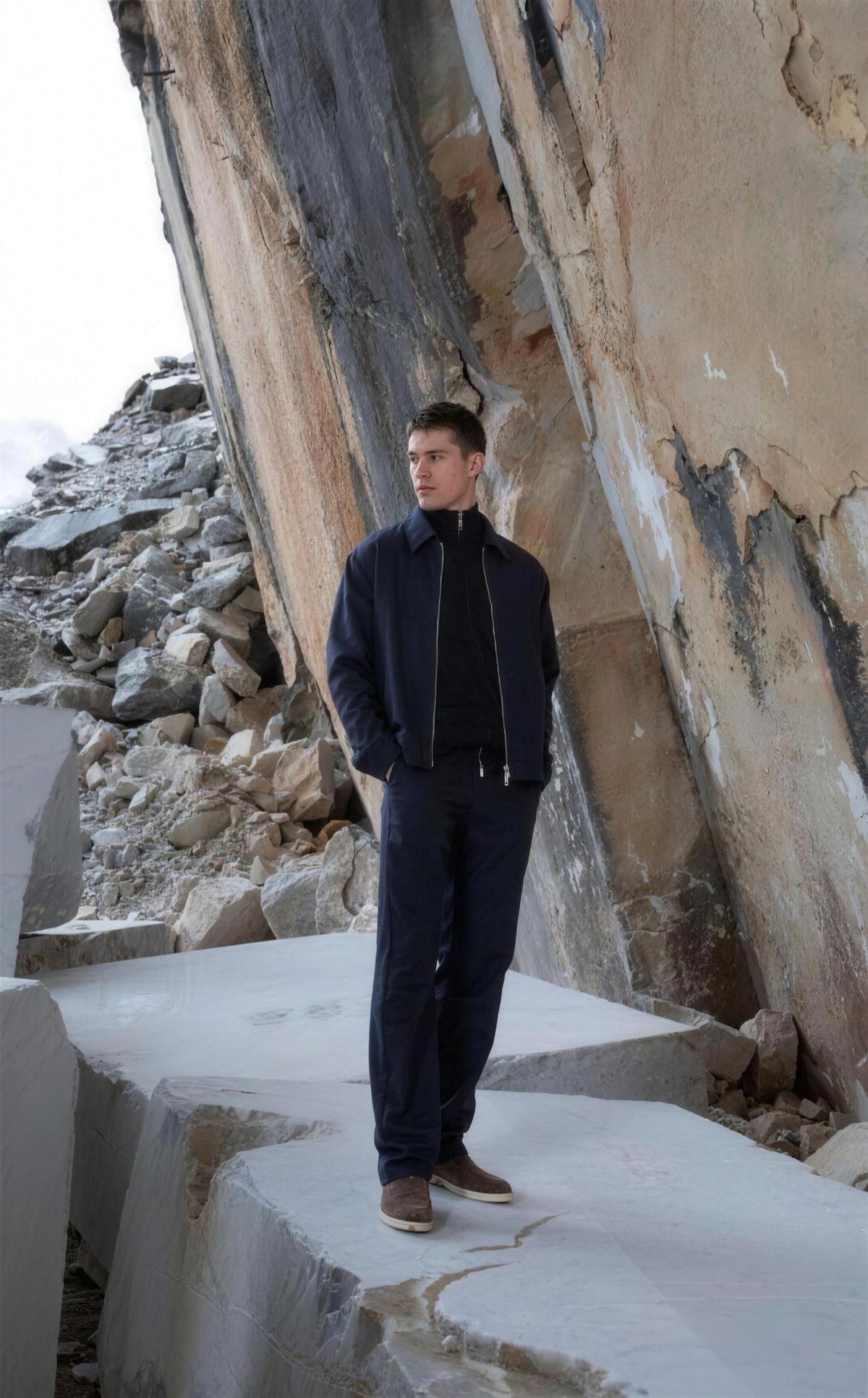 Navy Marco Pescarolo Urus jacket worn in a marble quarry