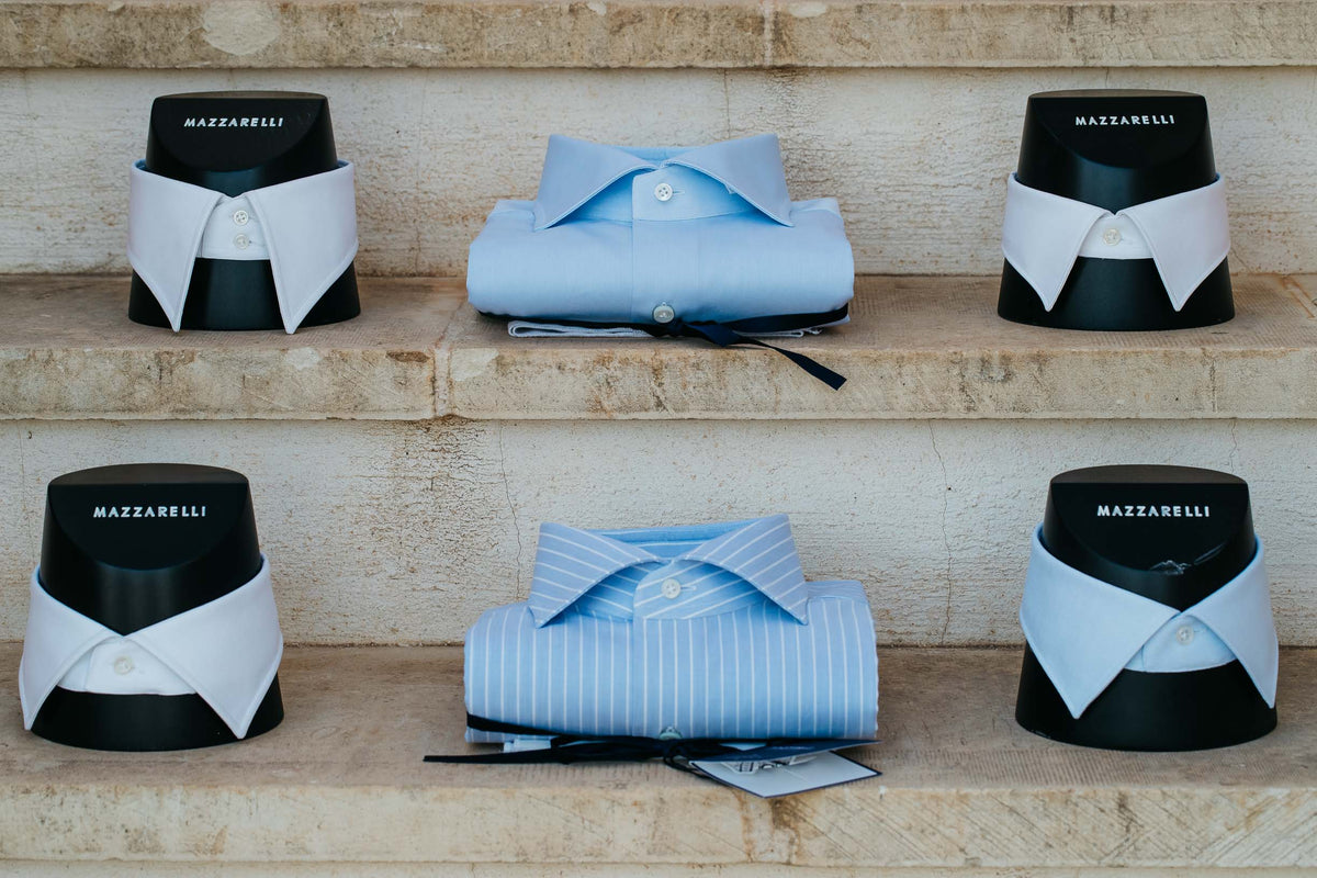 Mazzarelli shirts displayed on collar stands