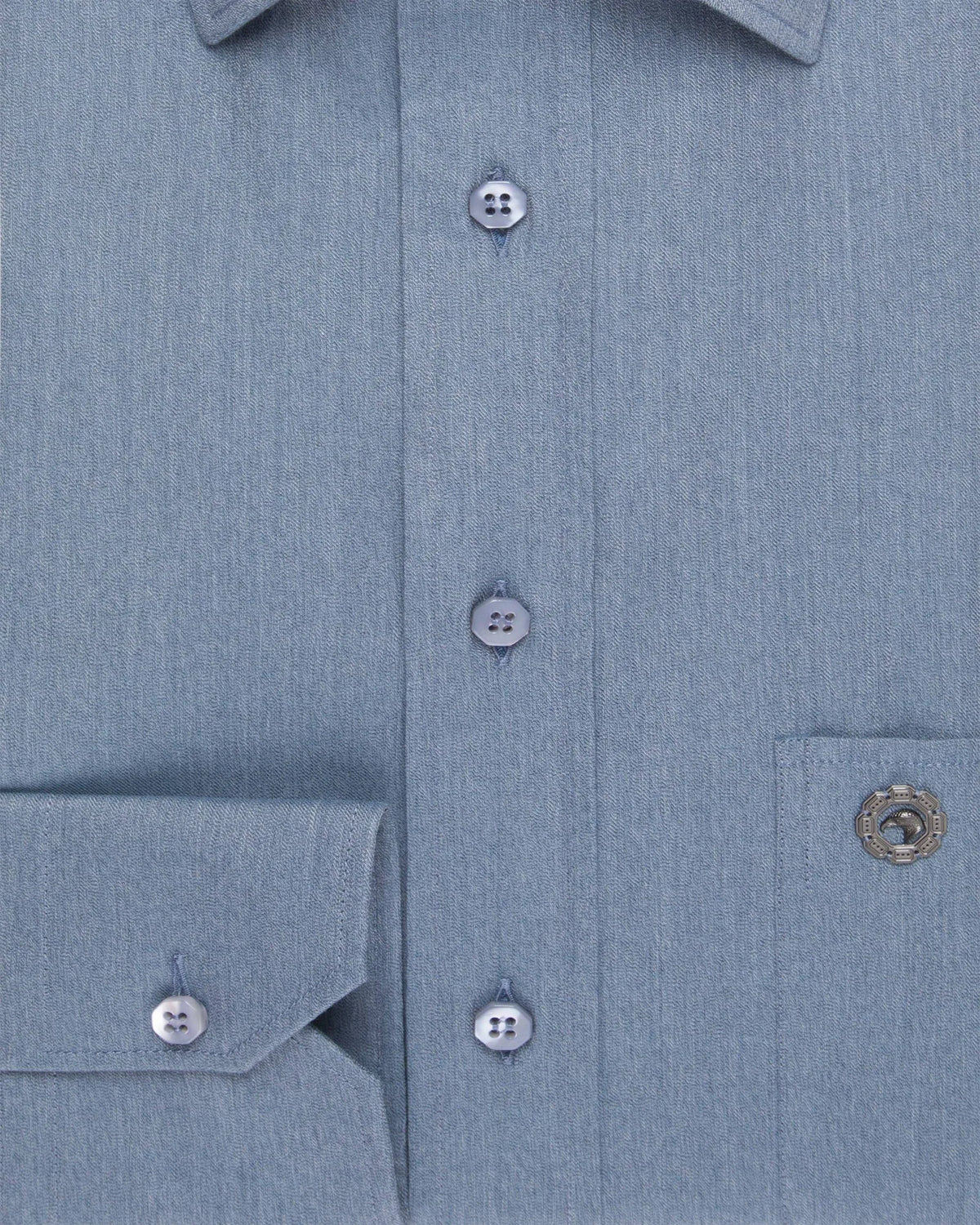 Close-up of a blue cotton Stefano Ricci shirt with mother-of-pearl buttons.