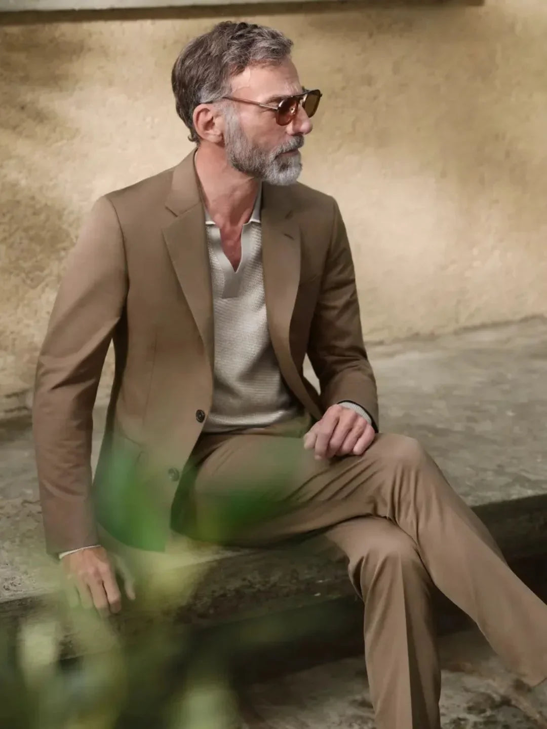 Client seated in a Zegna made-to-measure suit